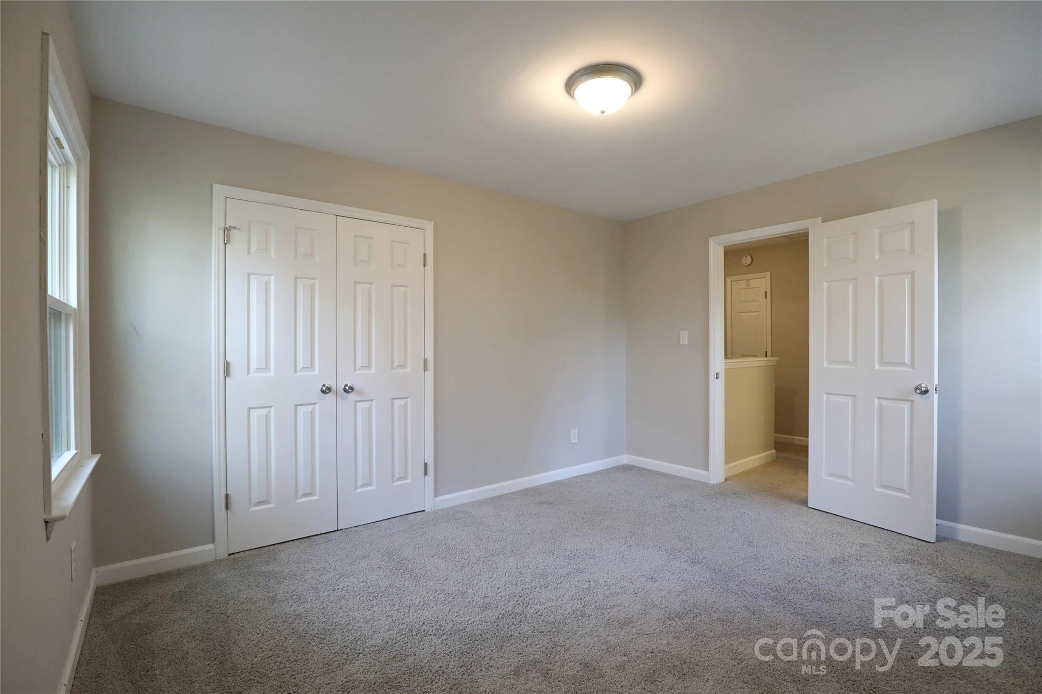 14027 Hackamore Drive Matthews, NC 28105 - Photo 22 of 29 a view of an empty room and closet area