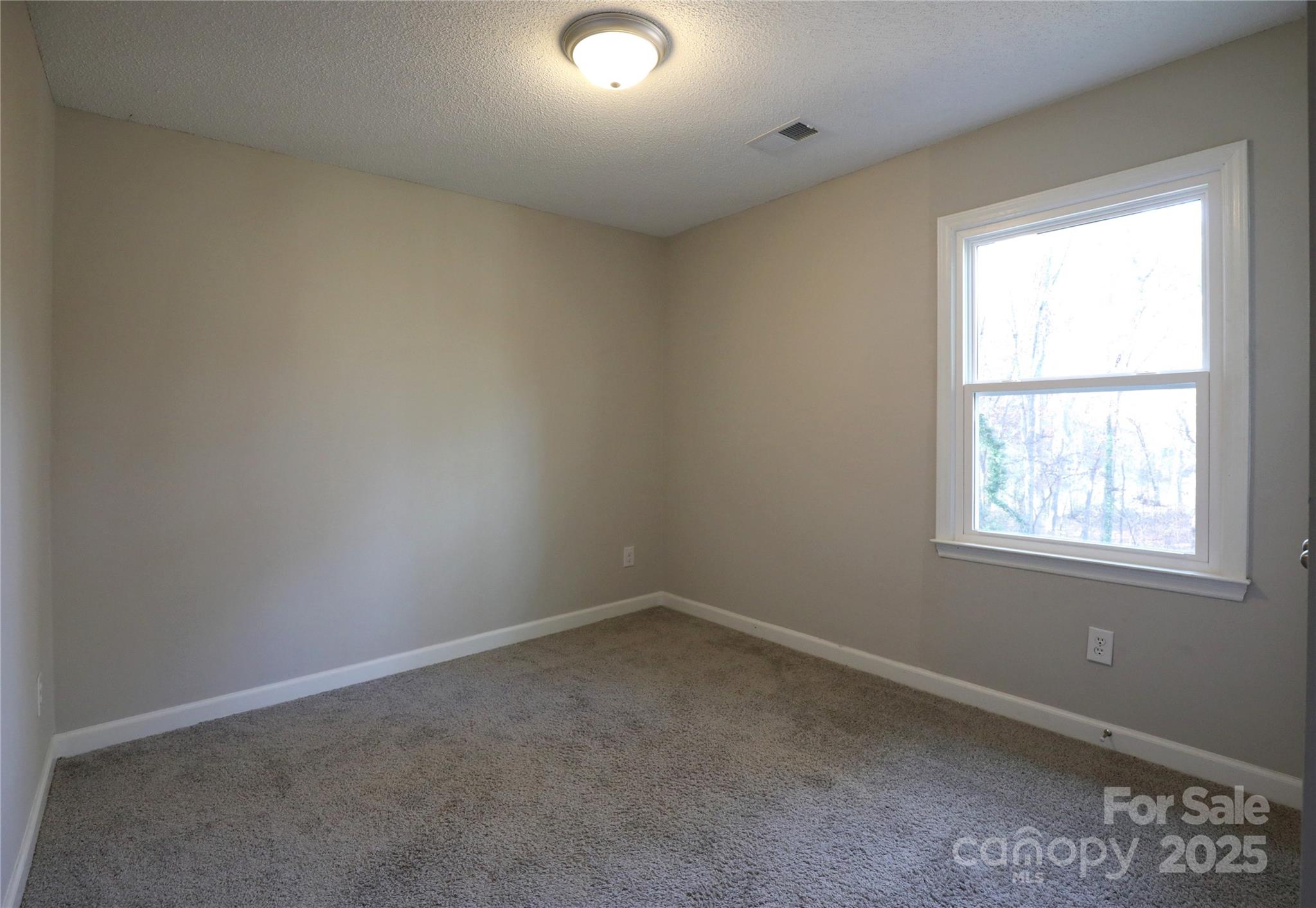 14027 Hackamore Drive Matthews, NC 28105 - Photo 23 of 29 an empty room with a window