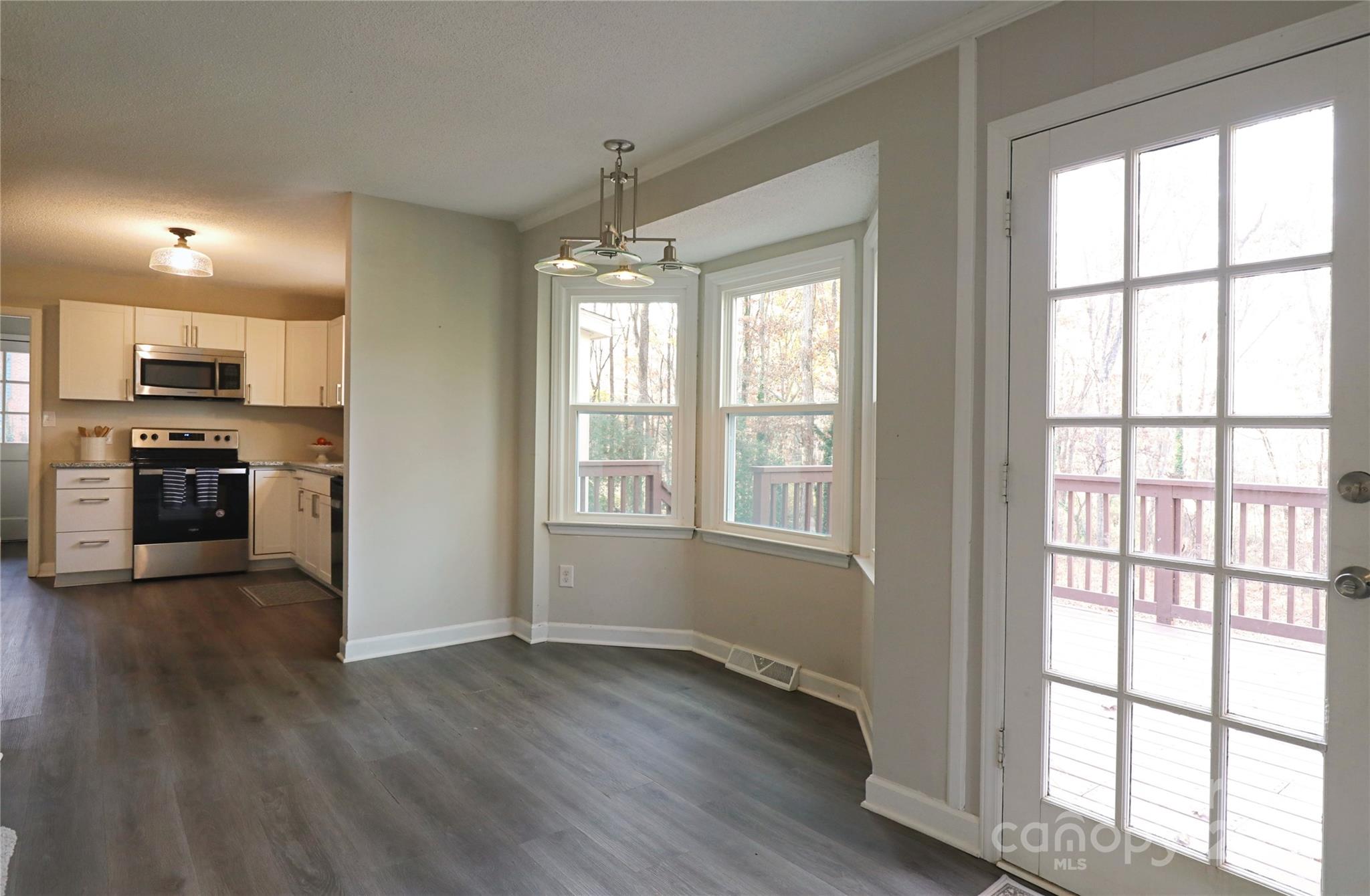 14027 Hackamore Drive Matthews, NC 28105 - Photo 5 of 29 a view of a kitchen with microwave and stove