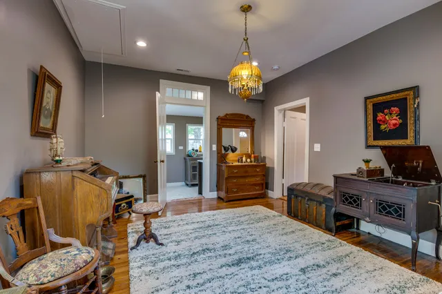 a view of a livingroom with furniture and a chandelier