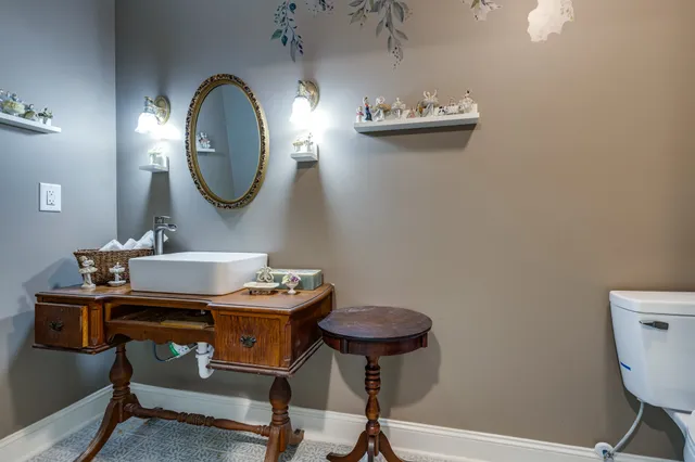 a room with a table and a mirror