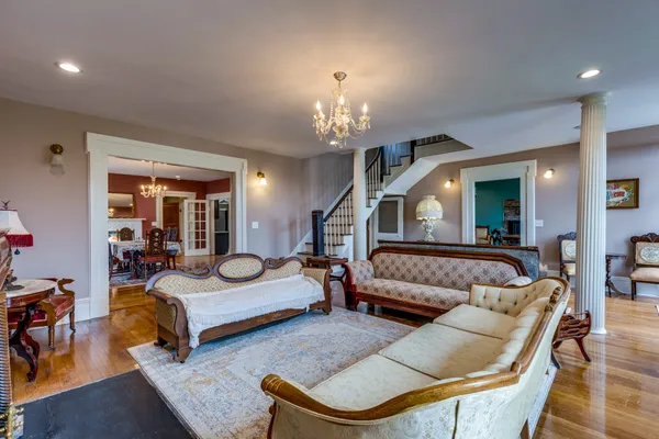 a bedroom with furniture and a chandelier