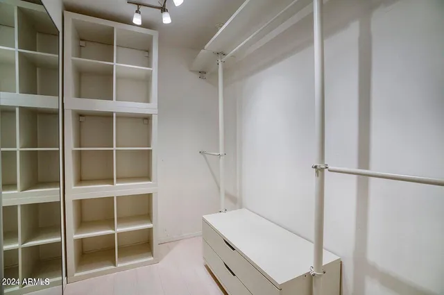 a view of an empty walk in closet