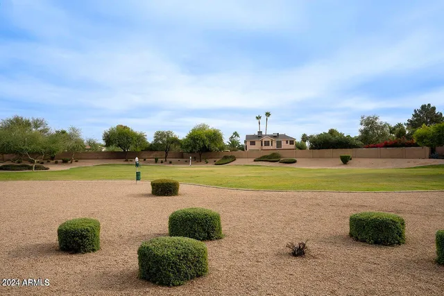 a view of a lake with a yard