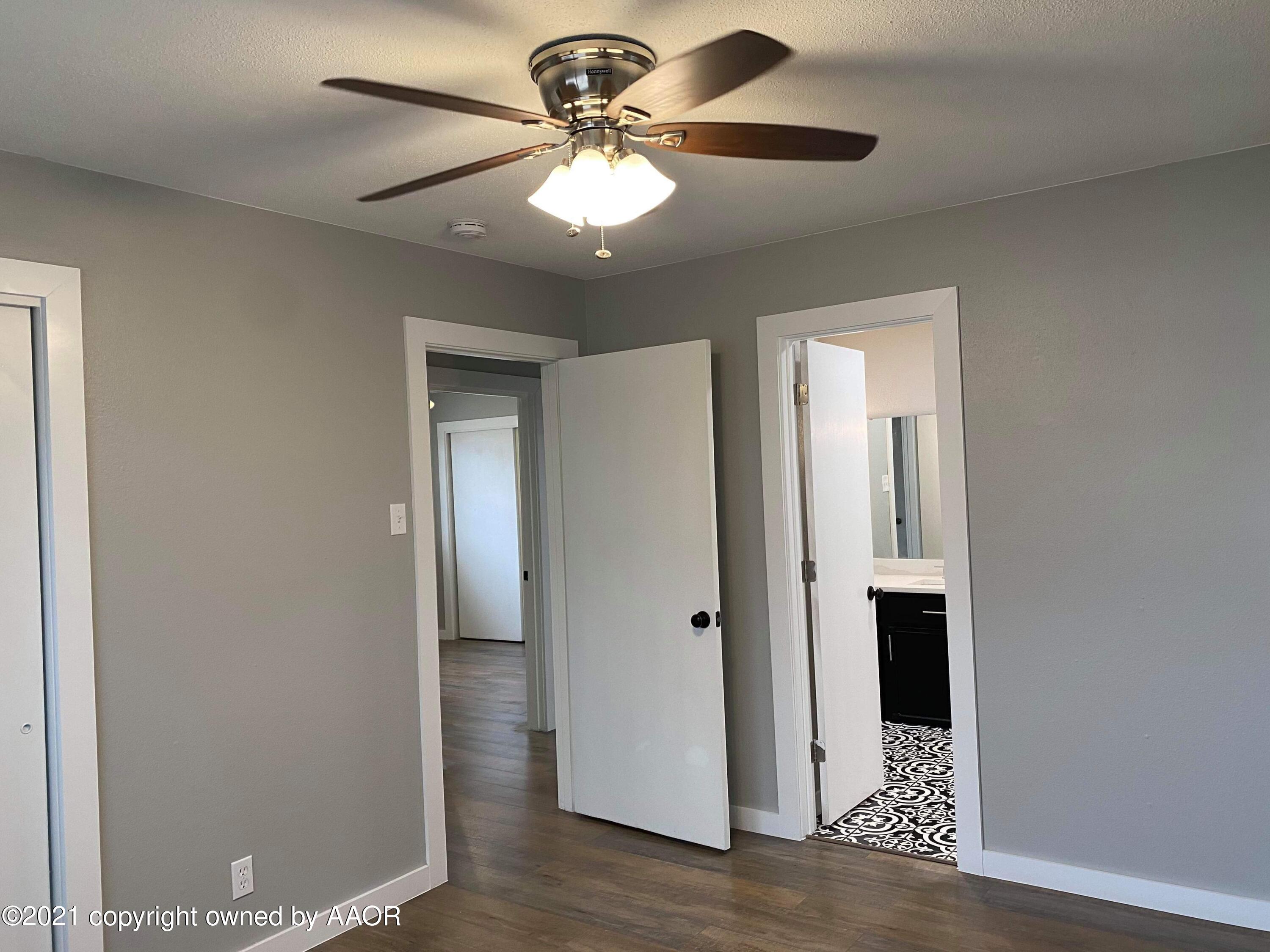 4304 South Bonham Street Amarillo, TX 79110 - Photo 4 of 9 a view of a livingroom with a chandelier fan