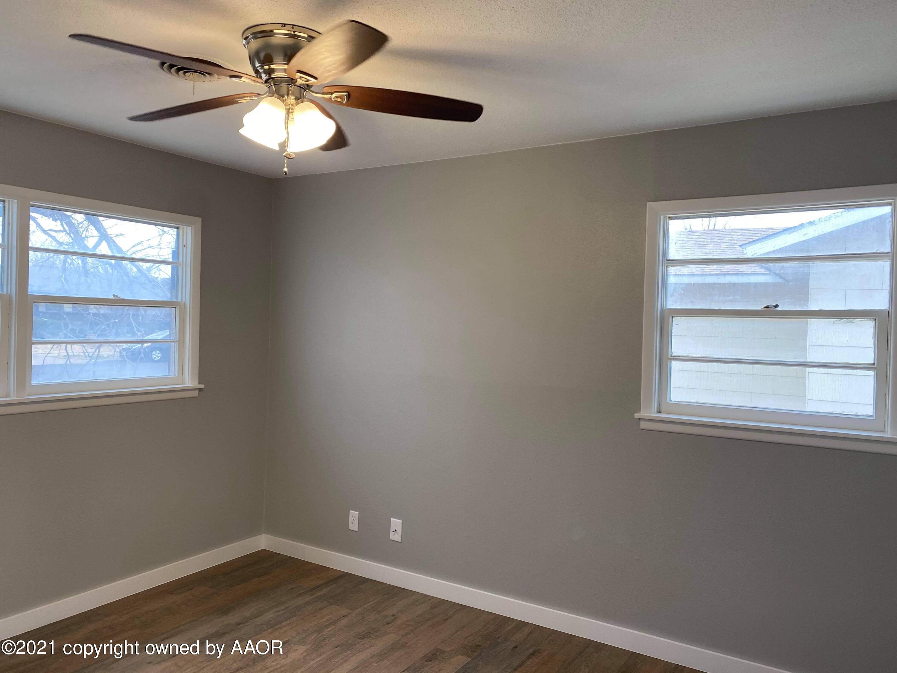 4304 South Bonham Street Amarillo, TX 79110 - Photo 5 of 9 an empty room with a window