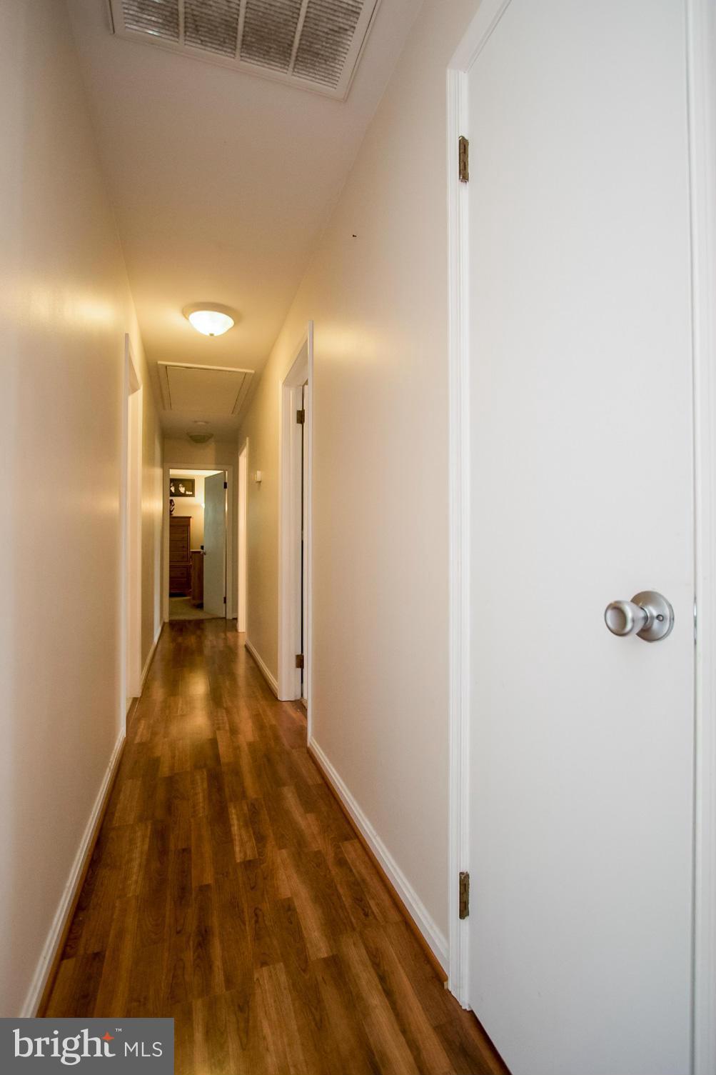 22501 Newtowne Neck Road Leonardtown, MD 20650 - Photo 10 of 27 Main Hall w/ Resilient Flooring