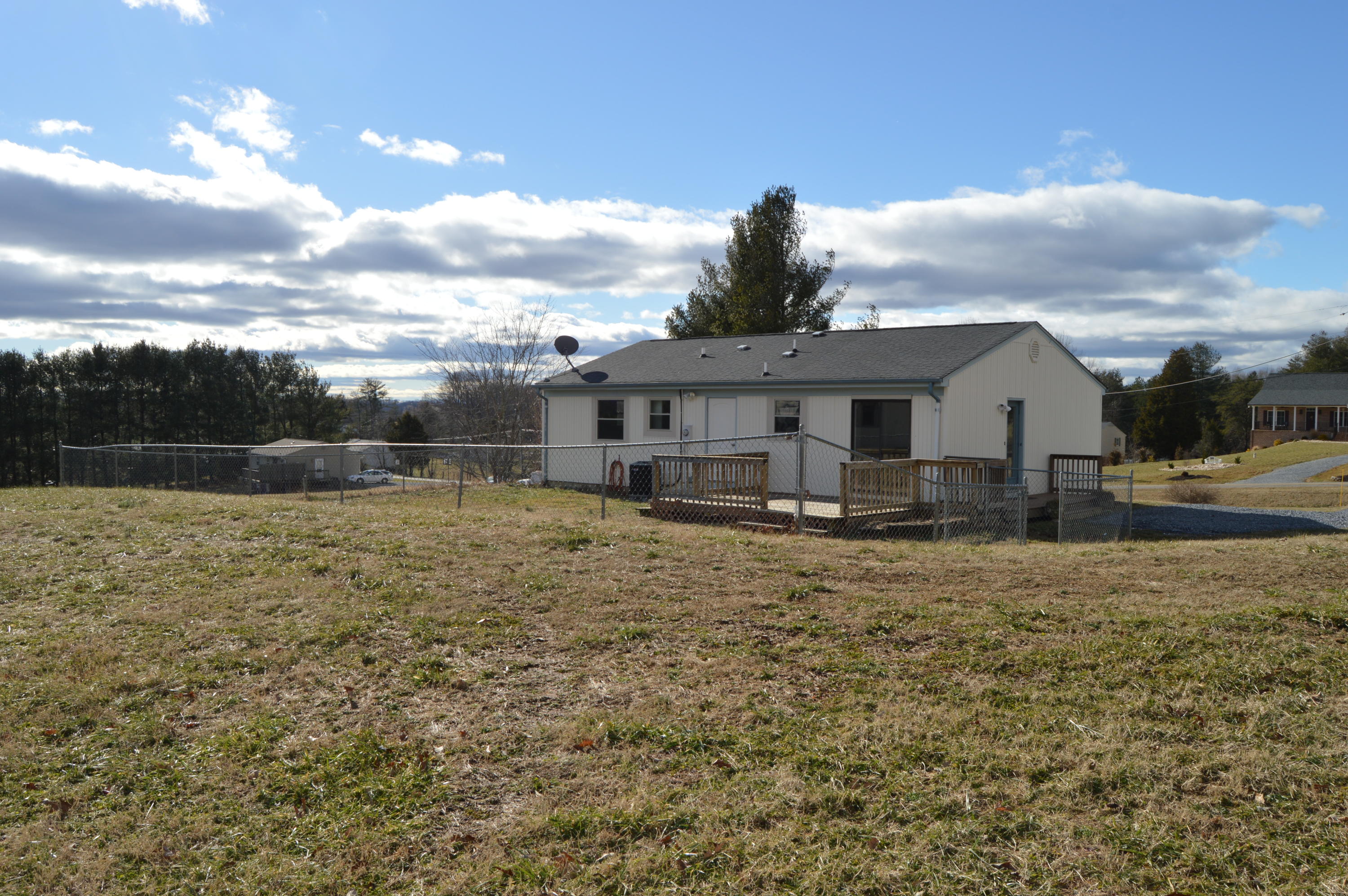 2398 Morgans Mill Road Goodview, VA 24095 - Photo 22 of 25 a view of a house with a yard