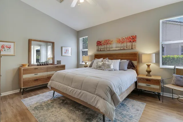 a bedroom with a bed and a table