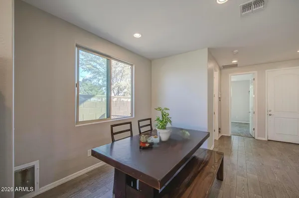 a view of a dining room with furniture window and outside view