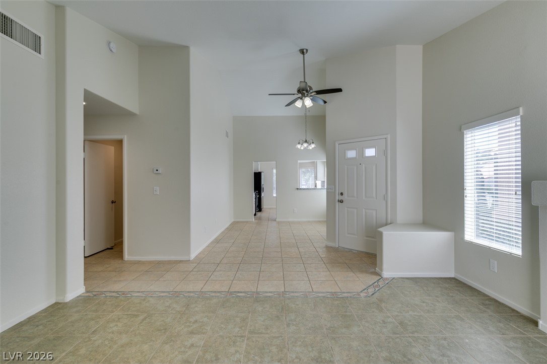 307 Cavalla Street Henderson, NV 89074 - Photo 15 of 44 Step into this luminous living space featuring high ceilings and durable tile flooring throughout.