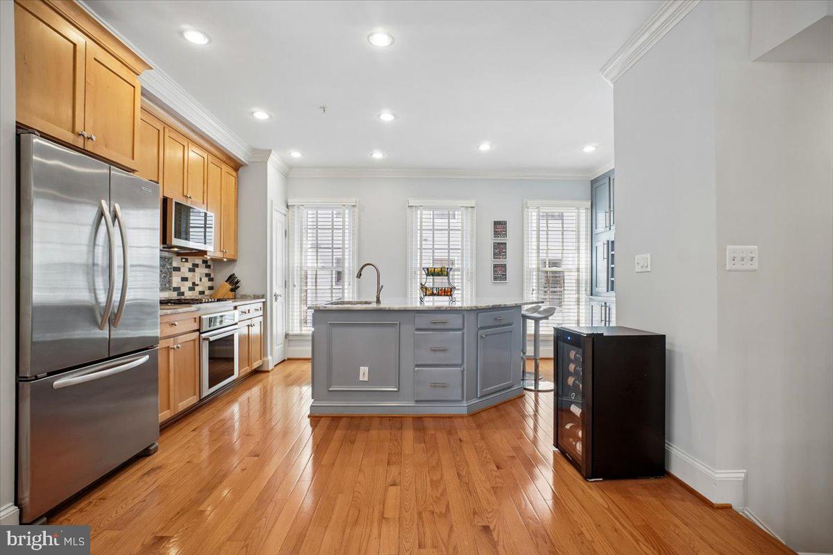 412 Pendleton Street Alexandria, VA 22314 - Photo 19 of 48 Modern kitchen with warm wood tones.