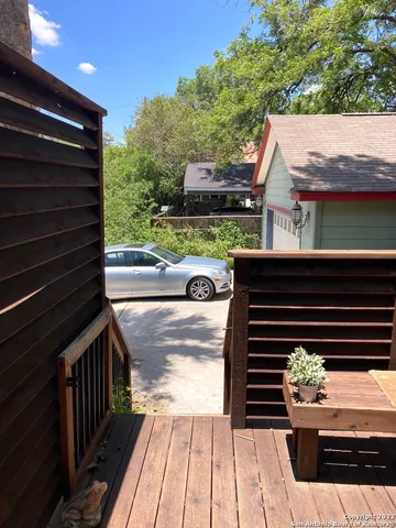 a view of a balcony with two chairs and a table