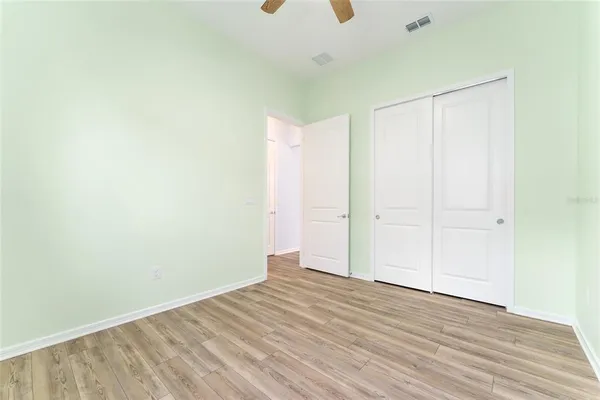 a bathroom with a sink toilet vanity and shower