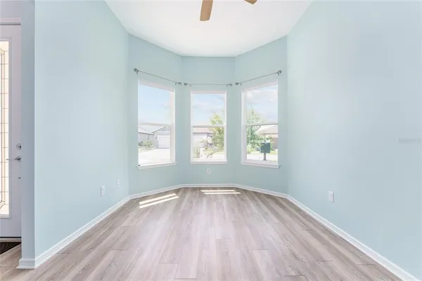 a view of a room with wooden floor