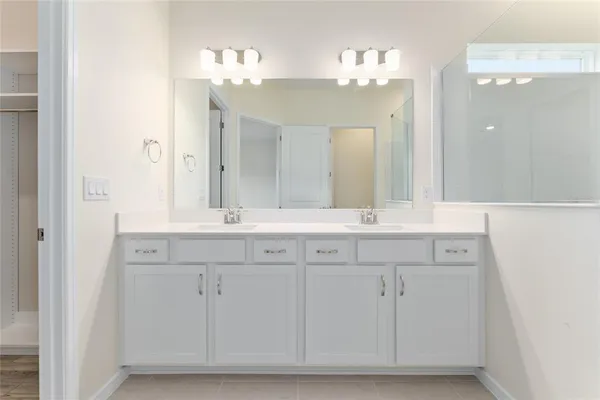 a bathroom with a shower and a sink