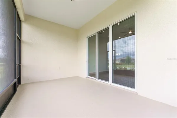 a view of an house with backyard space and balcony