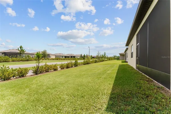 a view of a swimming pool with a yard