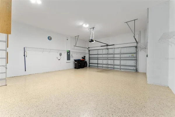 an aerial view of a house with swimming pool patio and outdoor seating