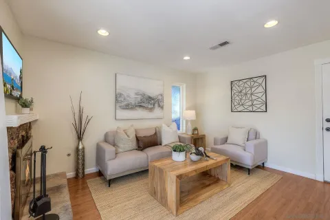 a living room with furniture and a flat screen tv