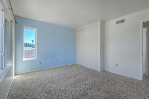 a view of an empty room with a window