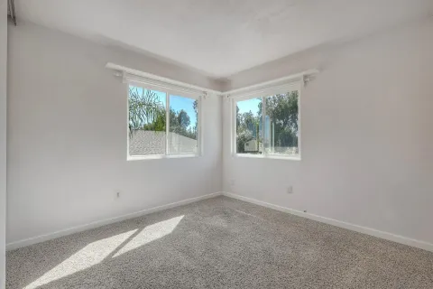 an empty room with windows