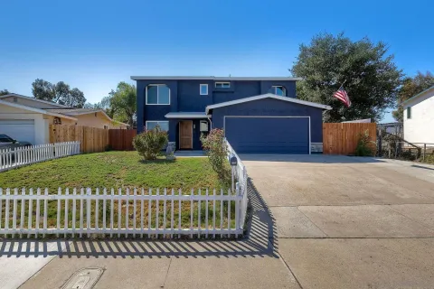 a view of house with yard