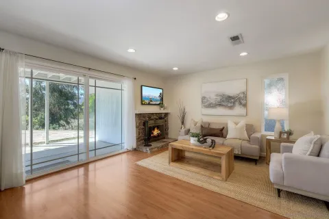 a living room with furniture and a fireplace