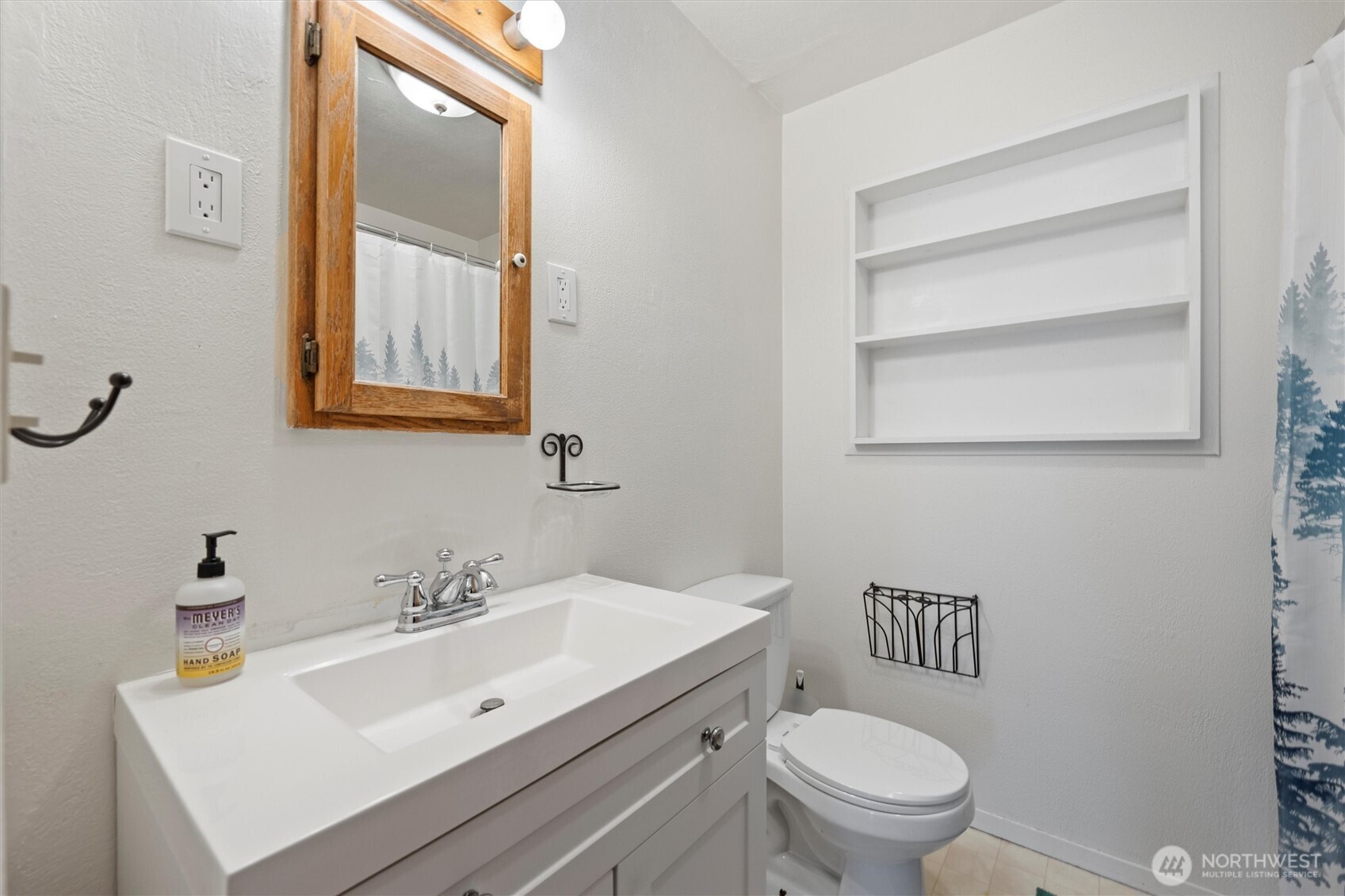 1162 D Street Southwest Ephrata, WA 98823 - Photo 18 of 37 a bathroom with a sink mirror vanity and toilet