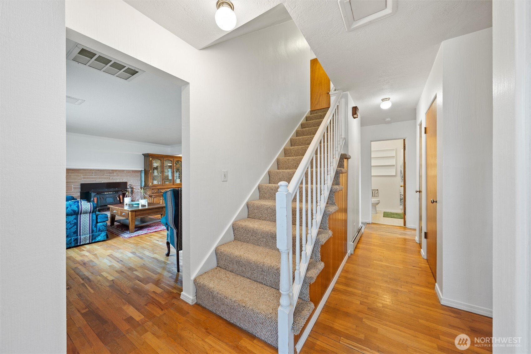 1162 D Street Southwest Ephrata, WA 98823 - Photo 23 of 37 a view of a hallway with wooden floor and staircase
