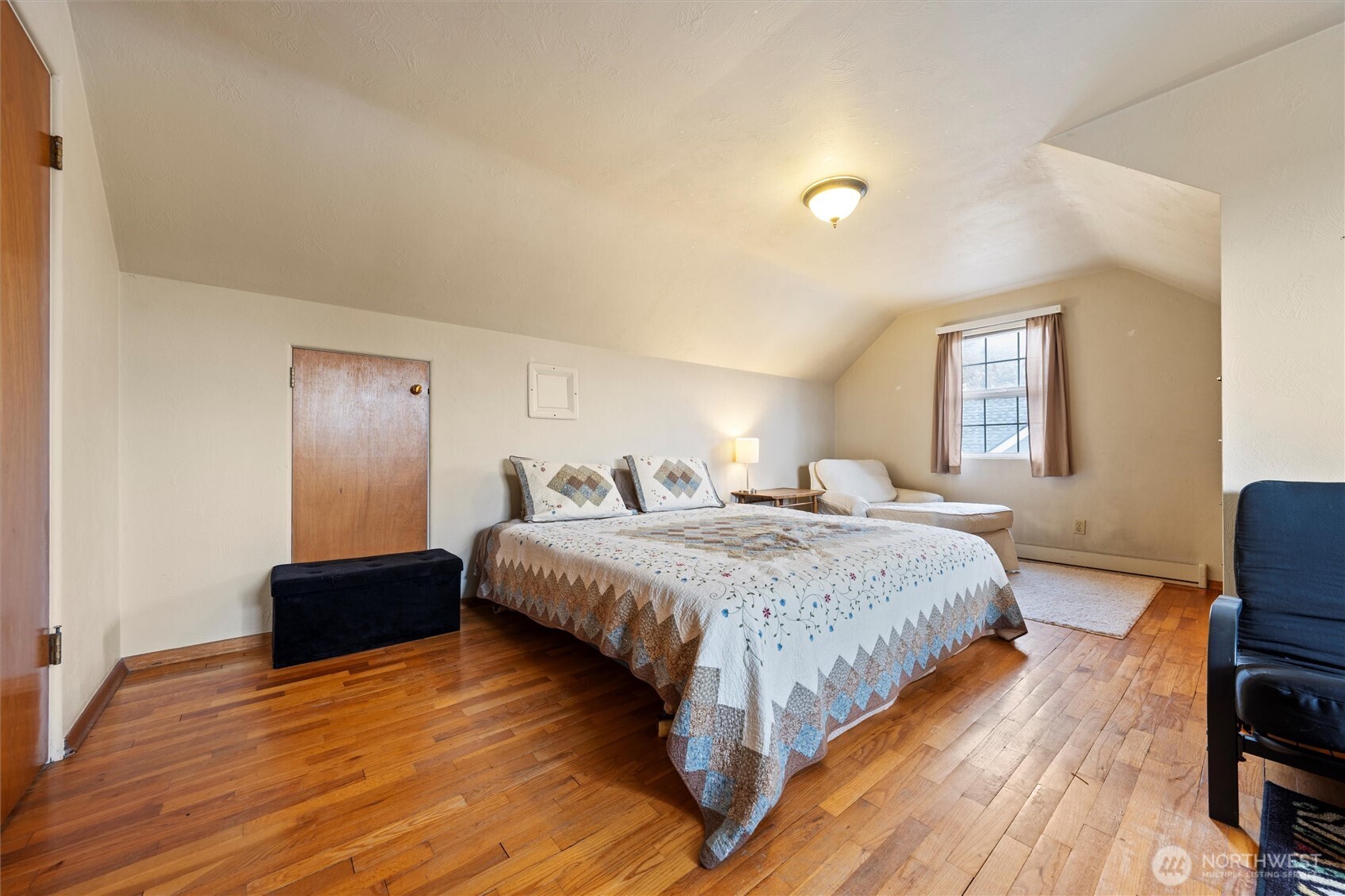 1162 D Street Southwest Ephrata, WA 98823 - Photo 24 of 37 a spacious bedroom with a bed and wooden floor