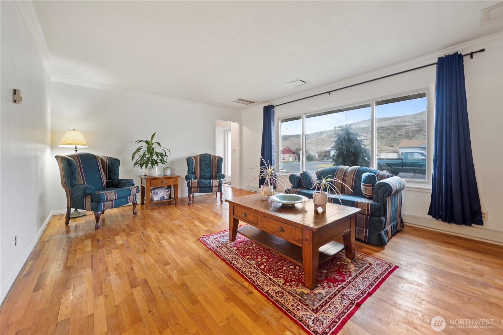 1162 D Street Southwest Ephrata, WA 98823 - Photo 3 of 37 a living room with furniture a large window and a rug