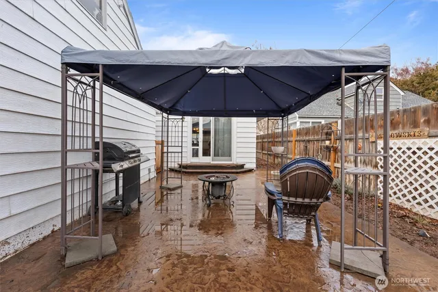 a patio with table and chairs