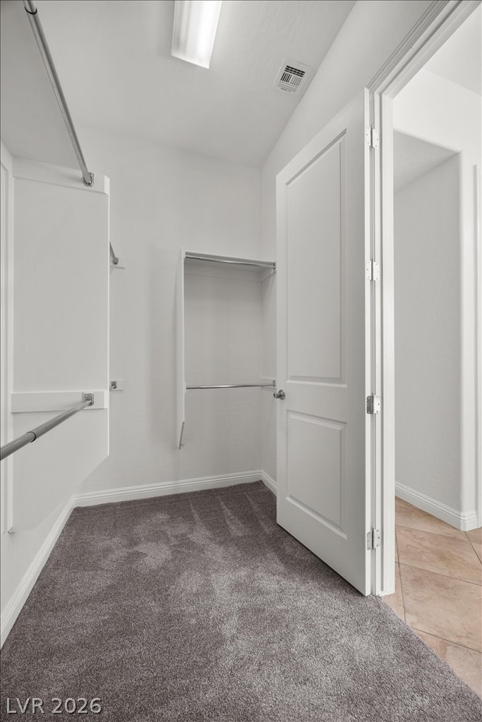 2125 De Rouge Avenue Henderson, NV 89044 - Photo 51 of 96 Ample hanging space and shelving define this generously sized walk-in closet.