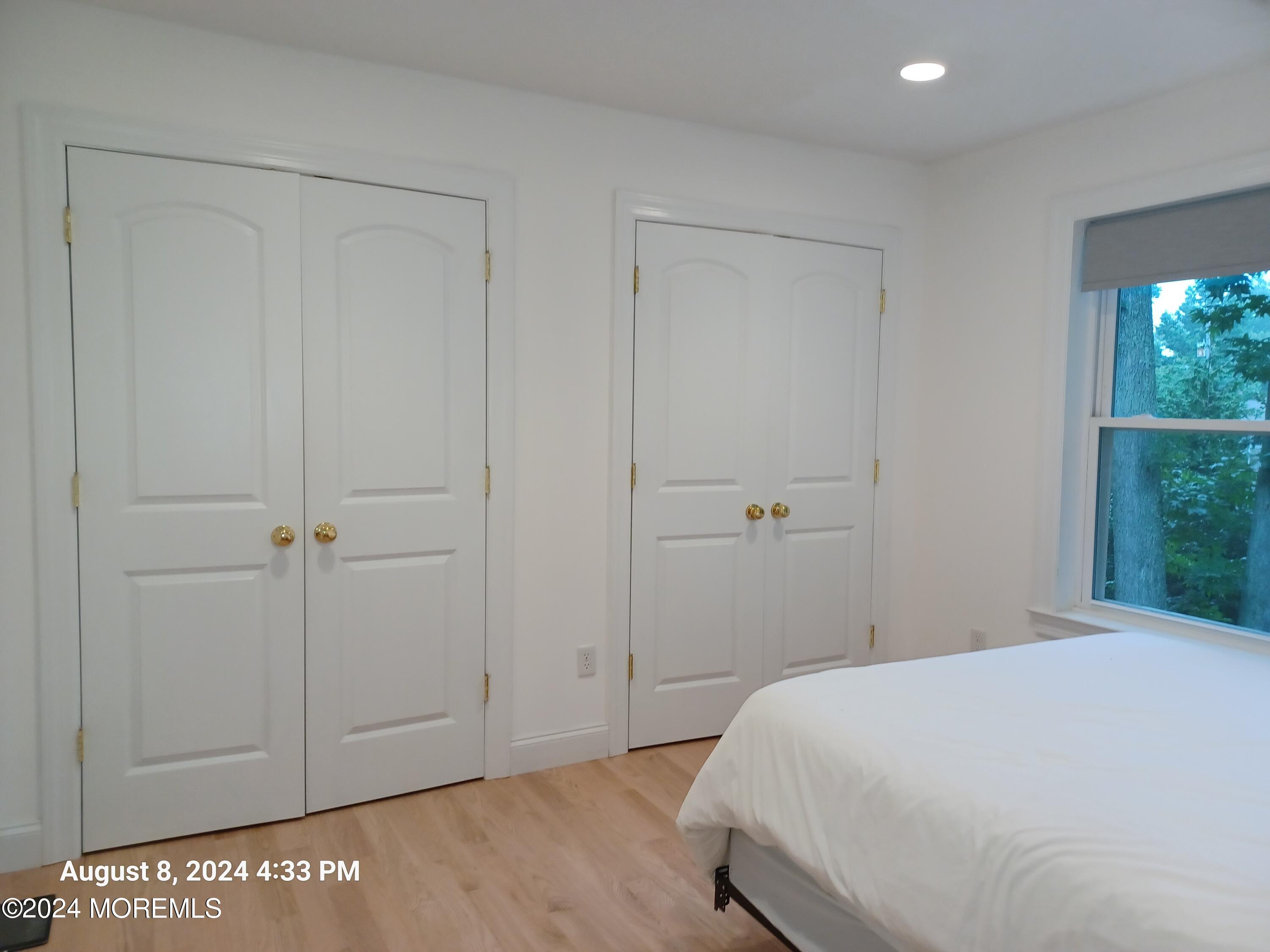 241 Woodcrest Road Oakhurst, NJ 07755 - Photo 16 of 19 a bedroom with a bed and a window