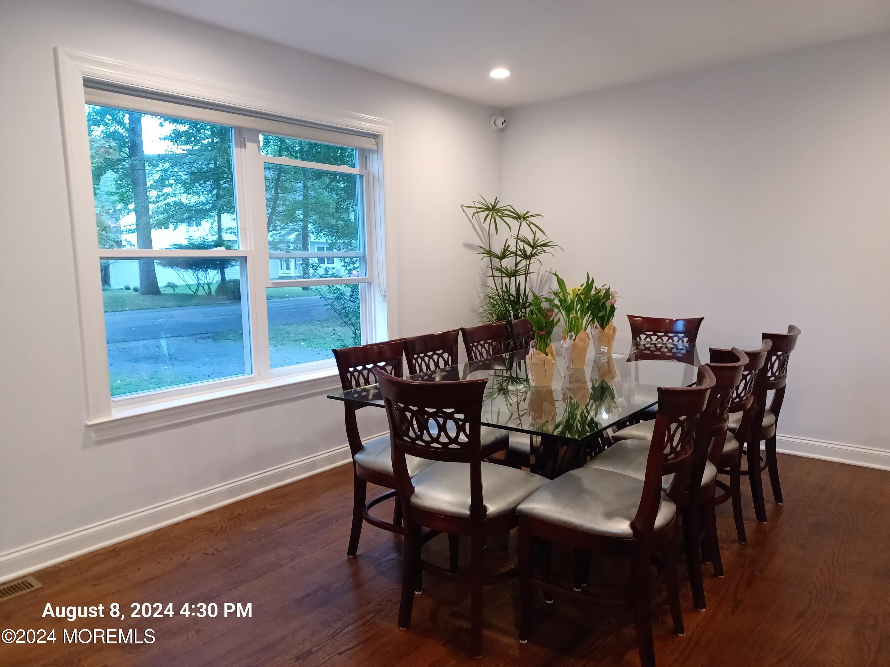 241 Woodcrest Road Oakhurst, NJ 07755 - Photo 4 of 19 a view of a dining room with furniture and wooden floor