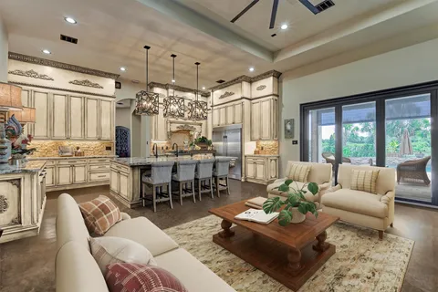 a living room with furniture and a chandelier