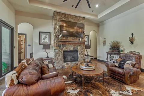 a living room with furniture and a fireplace