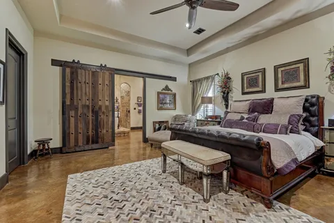 a living room with a bed furniture and a window