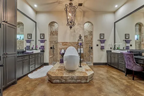 a living room with furniture a clock and a large mirror