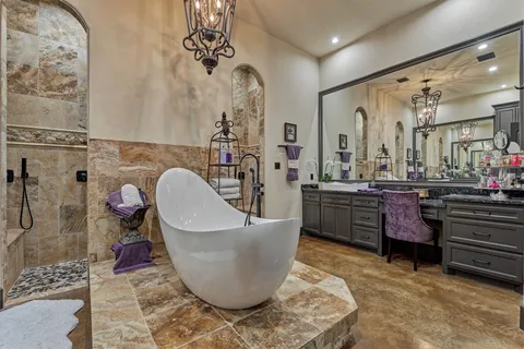 a living room with couches and kitchen view