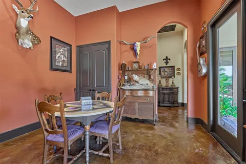a table and chairs in front of a building