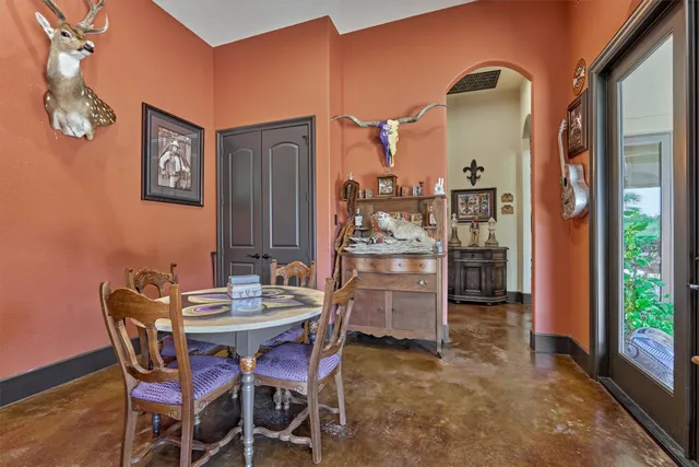 a table and chairs in front of a building