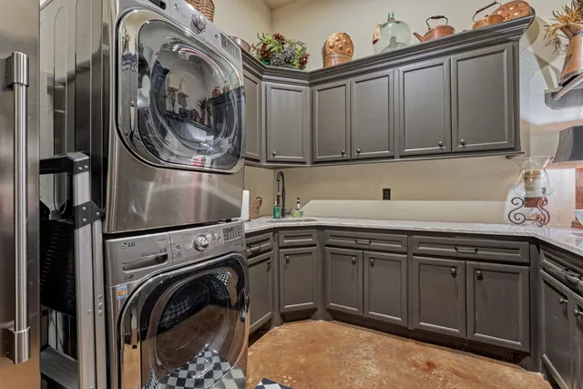 a bathroom with a granite countertop toilet sink and mirror