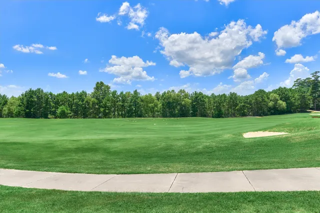 a view of a golf course with a lake