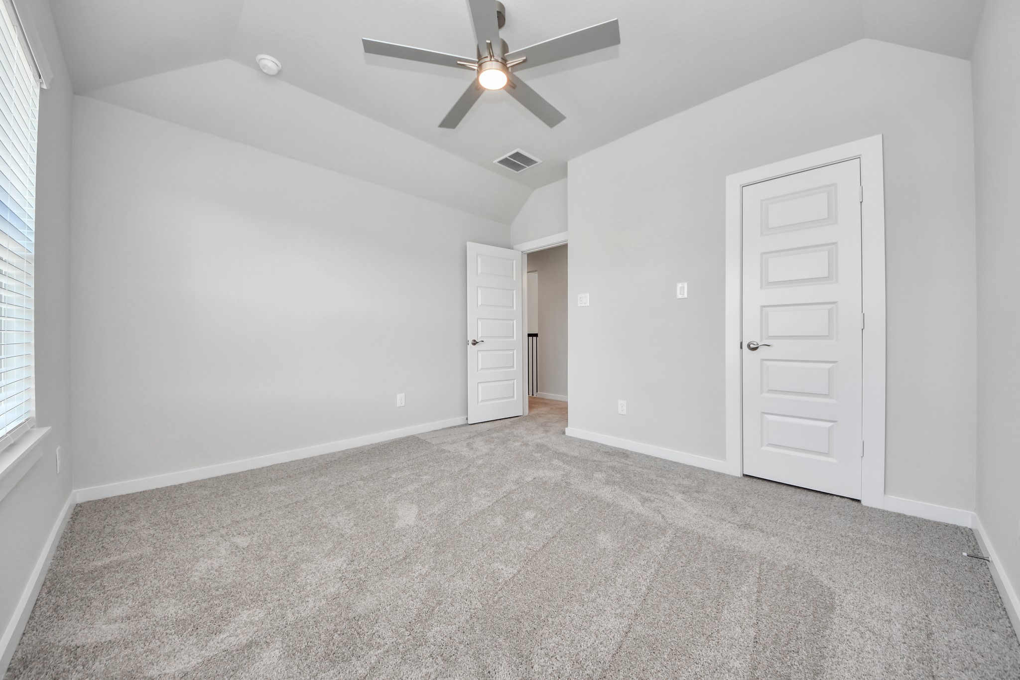 3102 Native Spg Drive Spring, TX 77373 - Photo 34 of 40 Generously sized secondary bedrooms featuring spacious closets, soft and inviting carpeting underfoot, large windows allowing plenty of natural light, and the added touch of privacy blinds for your personal retreat. Sample photo of completed home with similar floor plan. Actual colors and selections may vary.