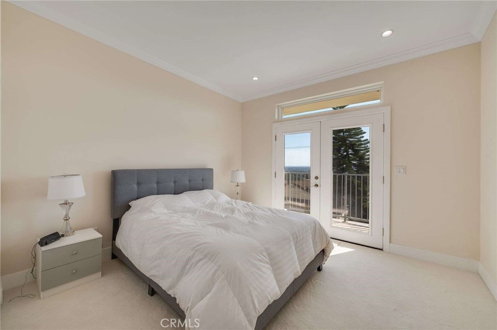 11837 Rideout Way Whittier, CA 90601 - Photo 32 of 44 a bedroom with a bed and a large window