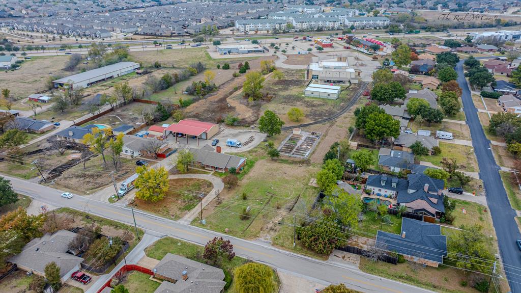 4407 Williford Road Sachse, TX 75048 - Photo 3 of 5 an aerial view of residential houses with outdoor space