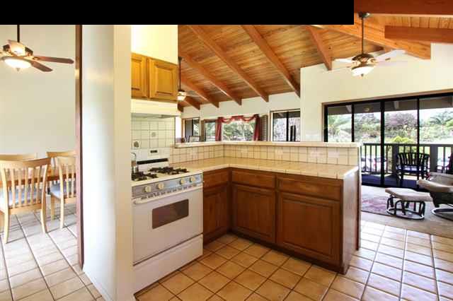 141 West Kuiaha Road Haiku, HI 96708 - Photo 4 of 15 a kitchen with stainless steel appliances granite countertop a stove and a sink