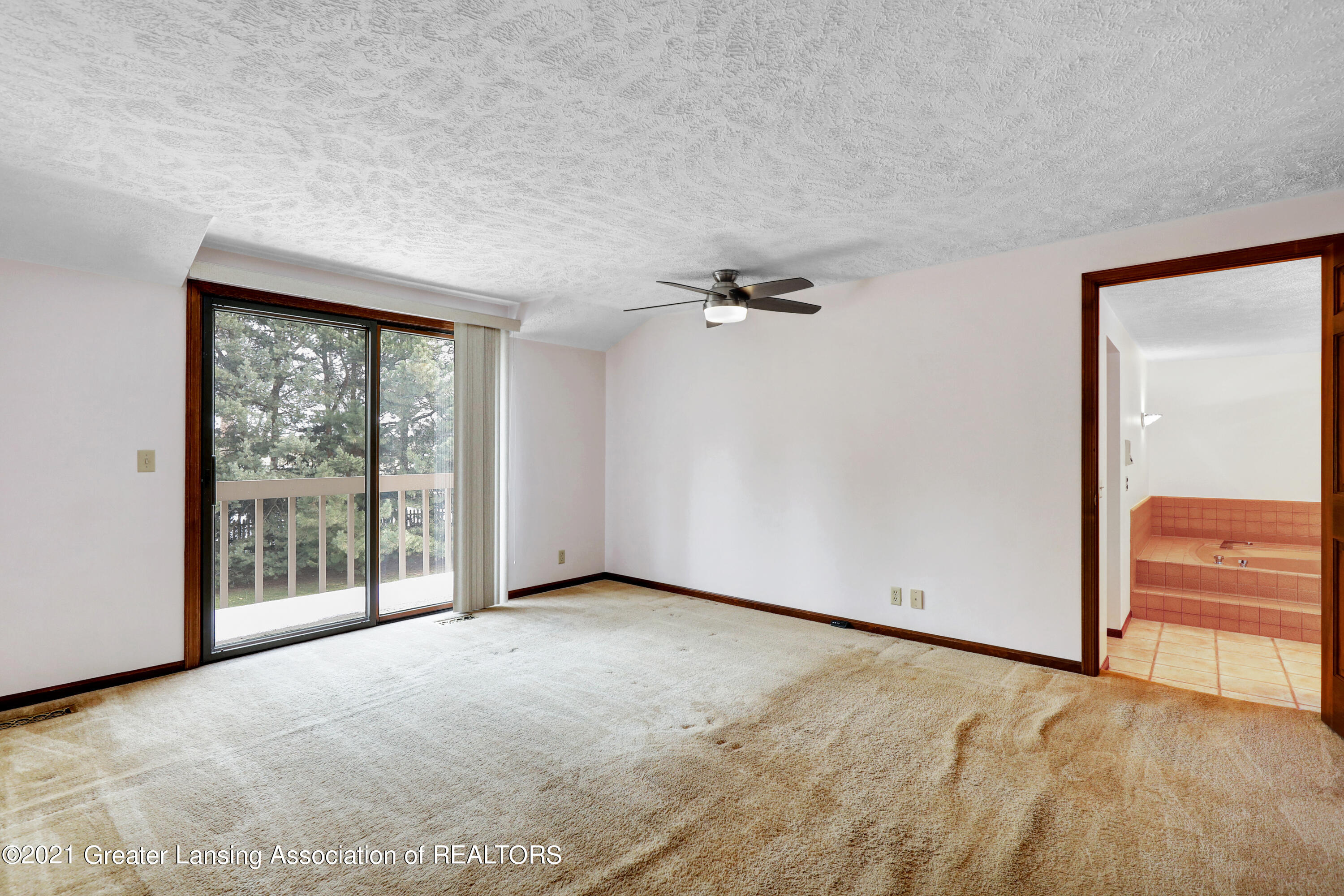1494 Dennison Road East Lansing, MI 48823 - Photo 21 of 40 Primary BR with Balcony overlooking